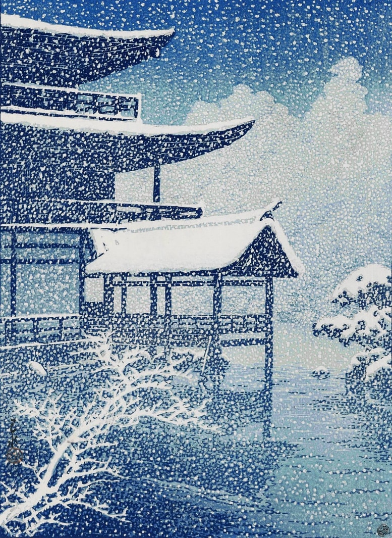 A woodblock print in shades of white, blue, and black showing on the left side the corner of a traditional Japanese structure with a roof that is gracefully upturned at the corners. The structure is surrounded by water. In the left foreground is a tree branch, barren of leaves, and outlined in snow. In the background is what looks like heavily snow covered trees, above which is a dark blue sky. The entire scene is filled with falling snow.